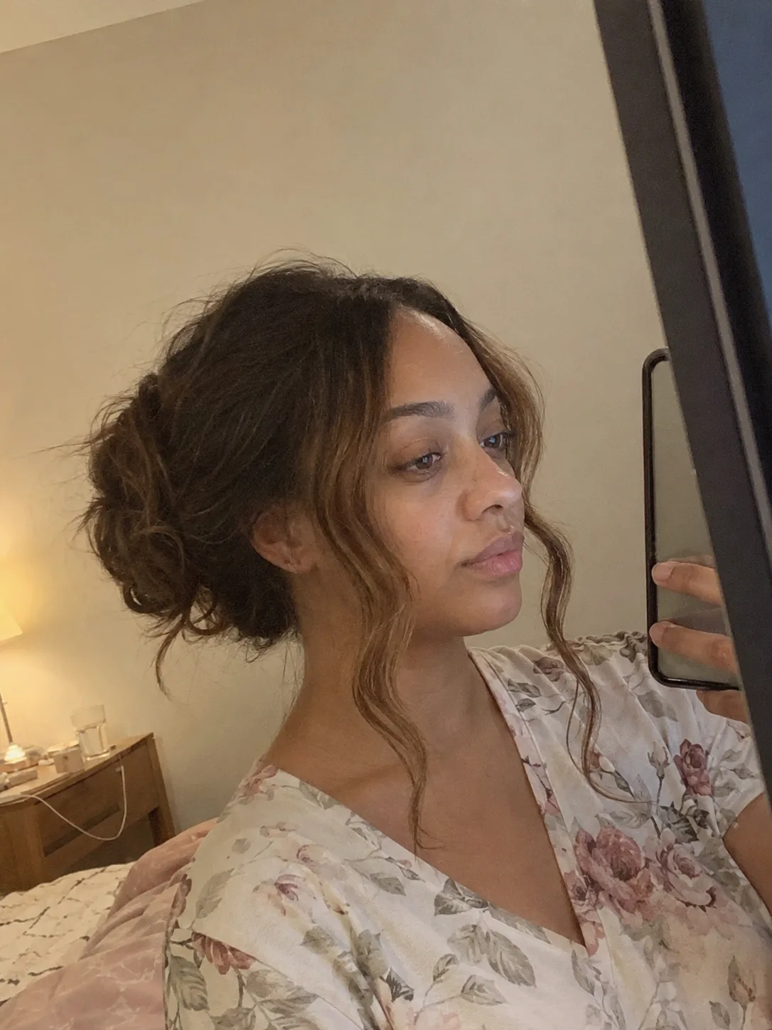 Low ponytail with waves wedding guest hairstyle and loose front pieces