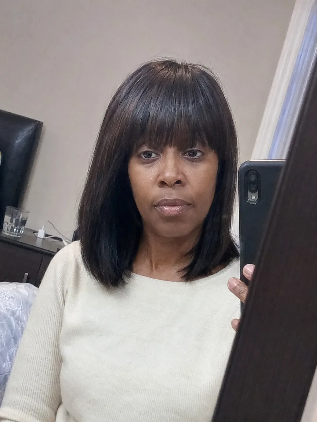 Medium-length wavy hair with curtain bangs and soft layers