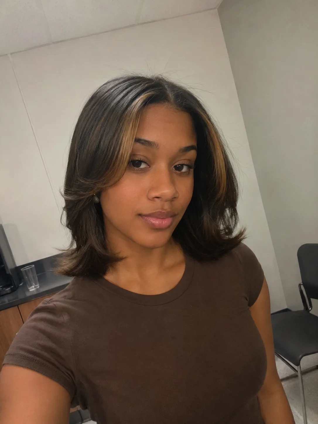Medium length prom hairstyle with flipped ends showing humidity movement