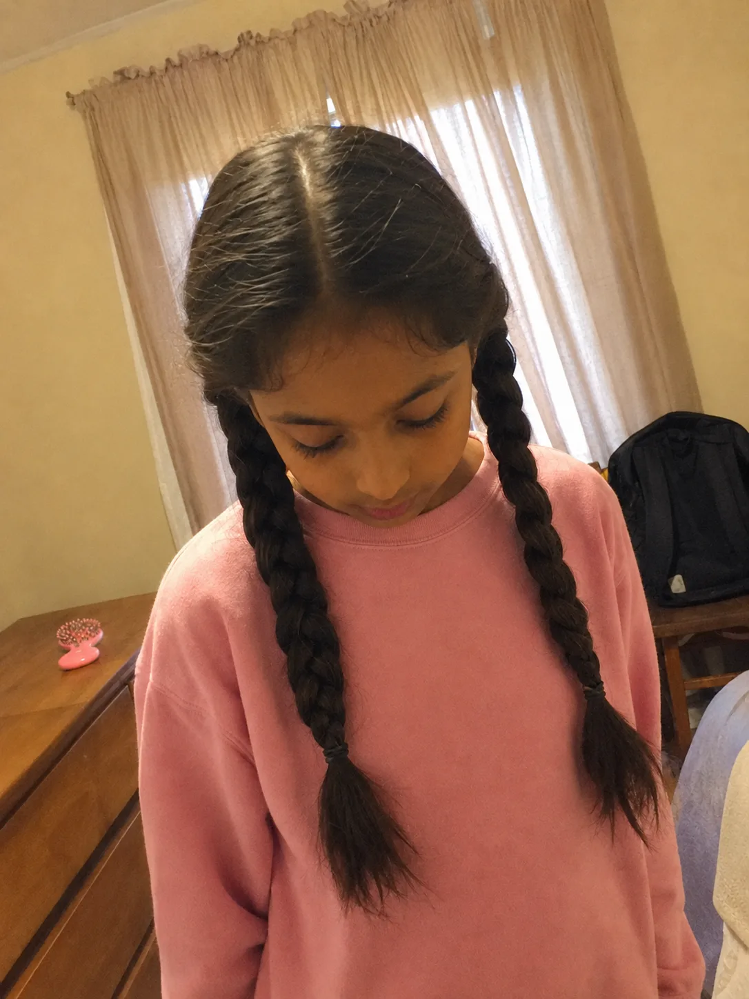 Natural curly puff hairstyle for textured back to school hair routines after summer damage