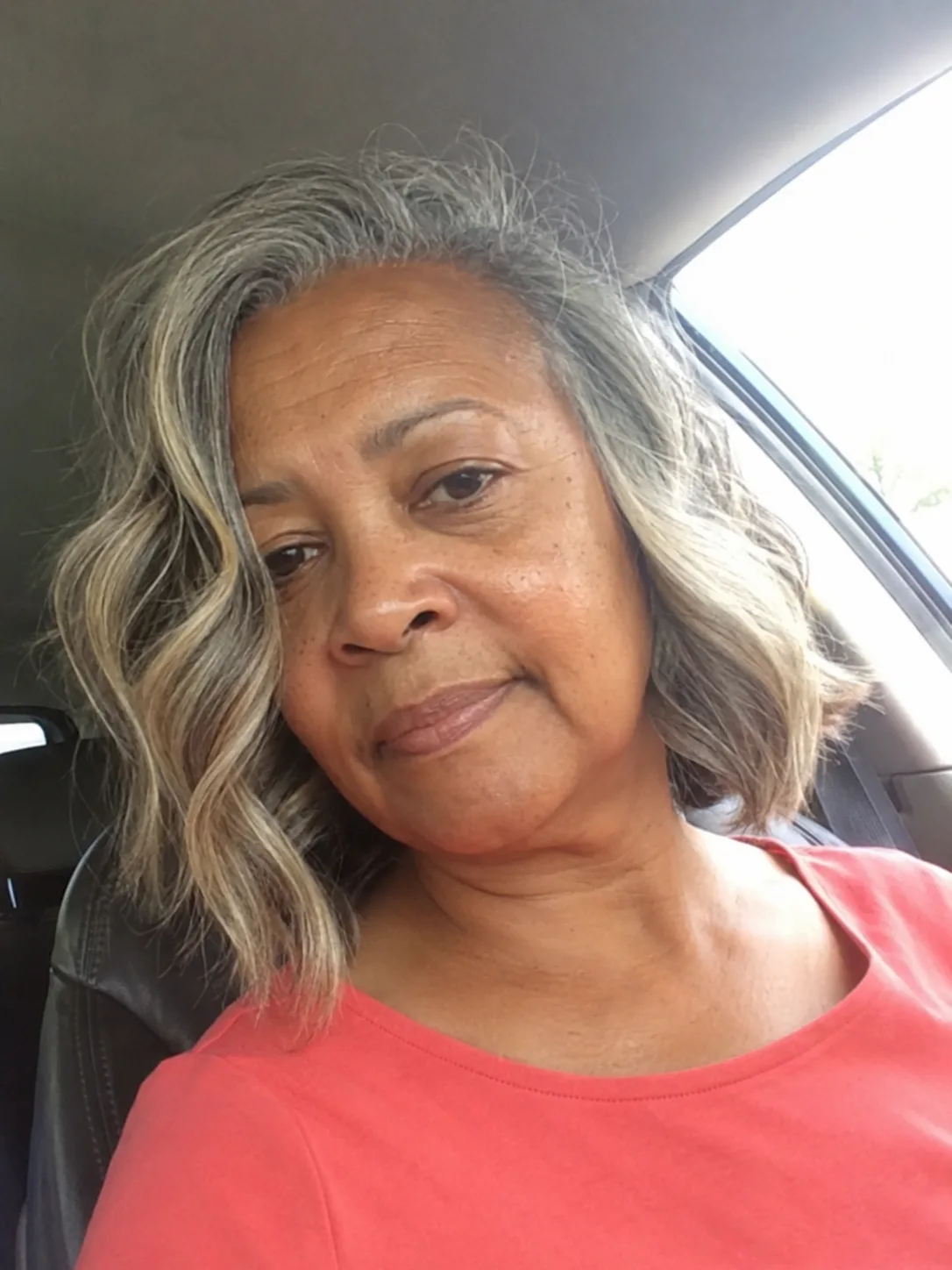Nicely texturized heavier front fringe sitting perfectly above the brows on a senior woman