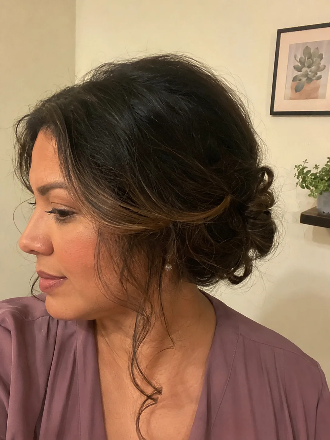 Polished wedding blowout on long dark hair showing subtle bend and beautiful end movement