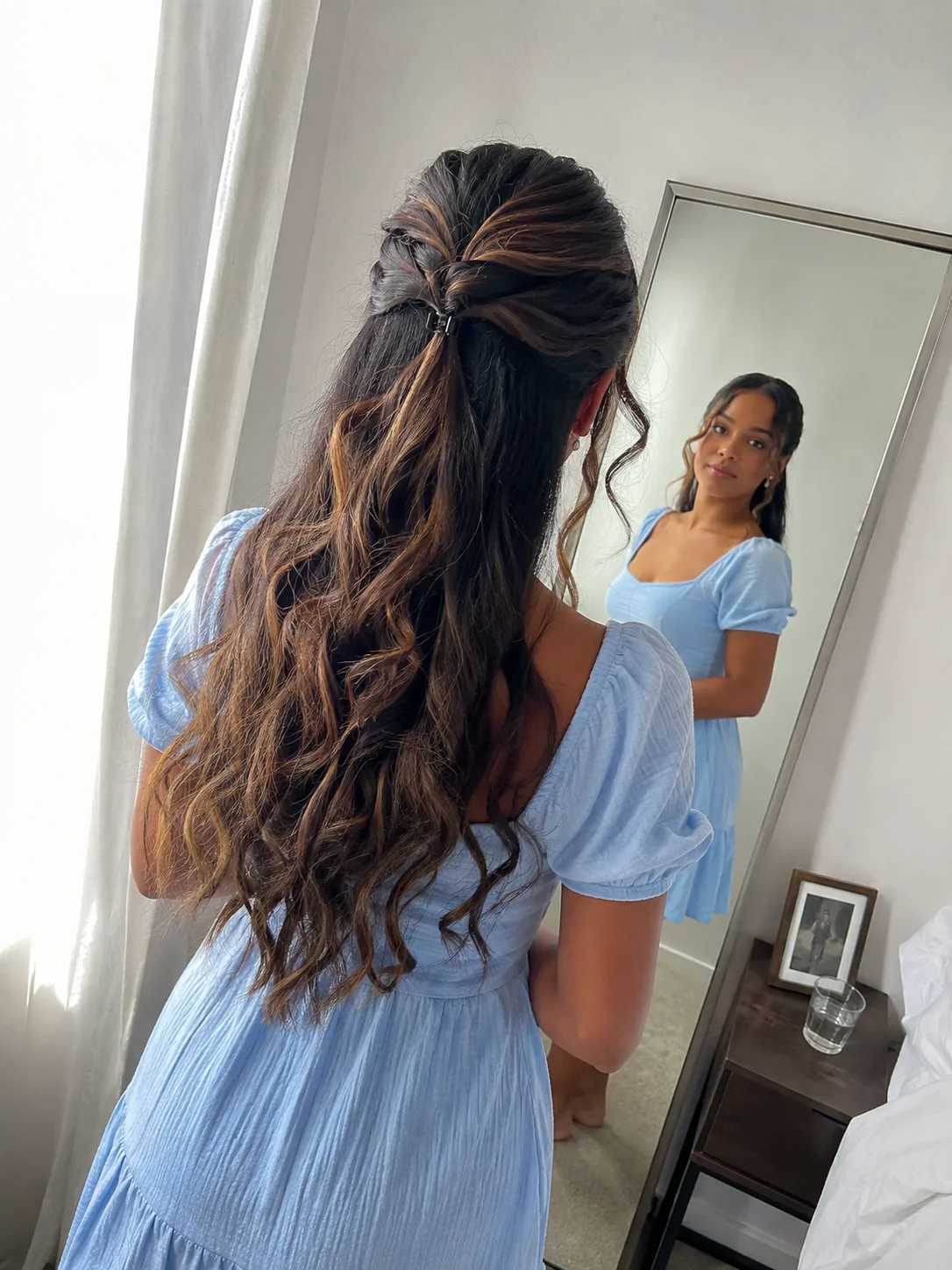 Secure low-set twisted updo anchored near the occipital bone on long ash-blonde hair