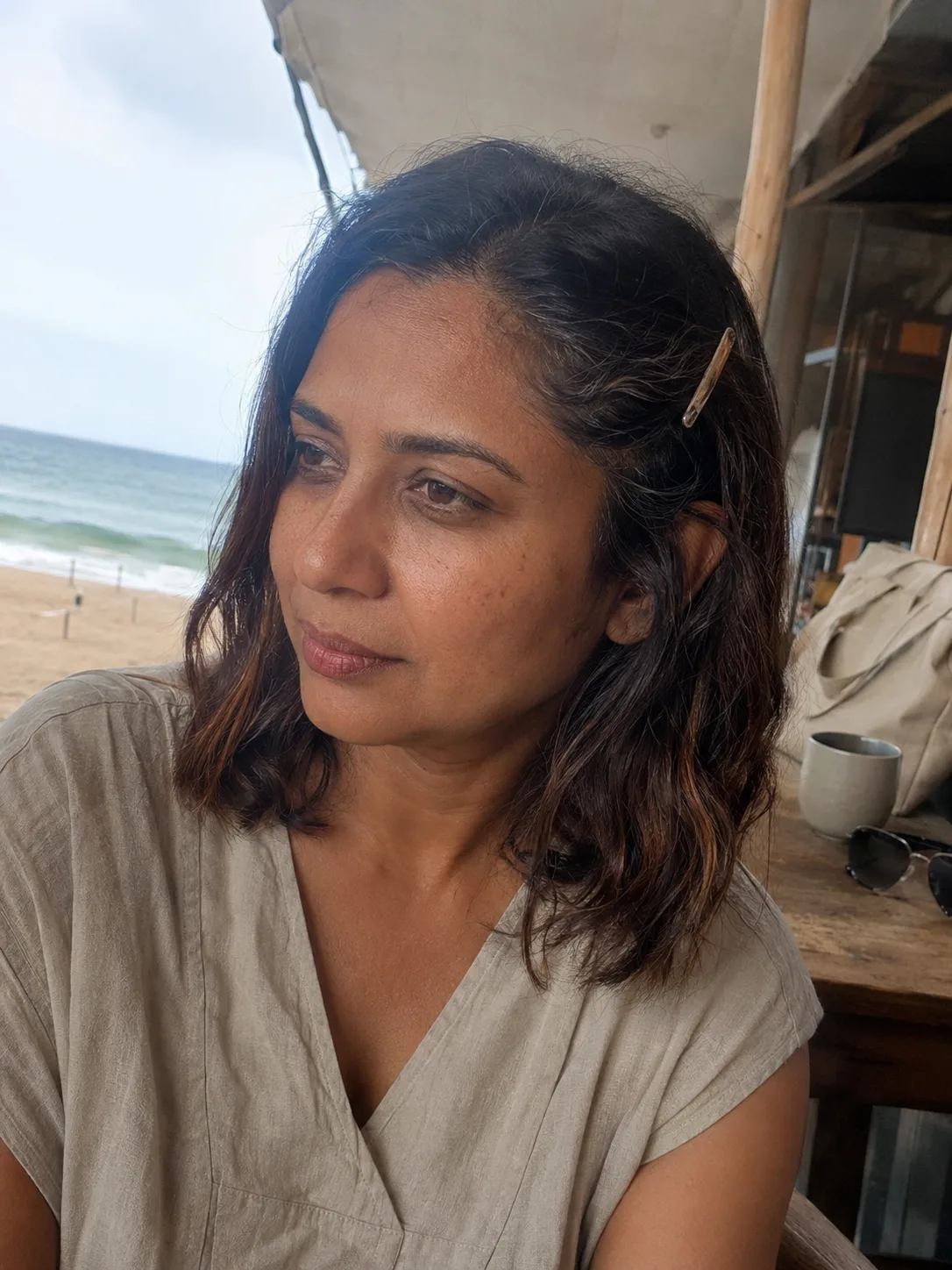 Short beach waves held back with a flat side clip in ocean wind