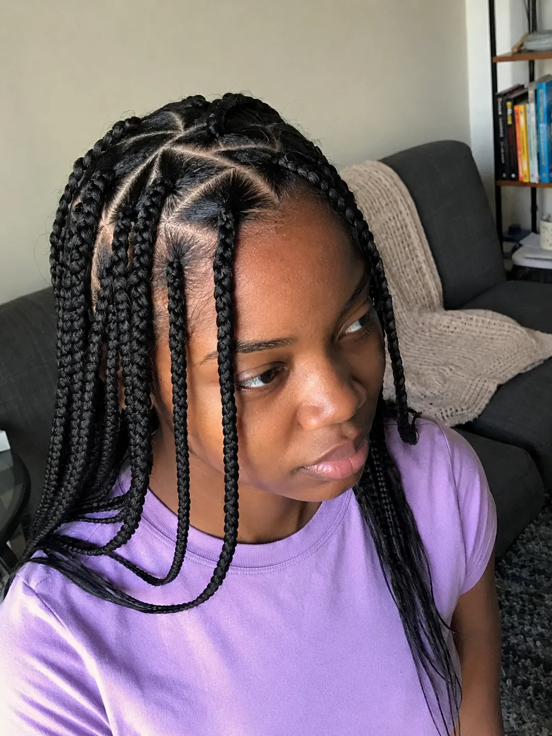 Short black braided bob hairstyle with side part for summer braids