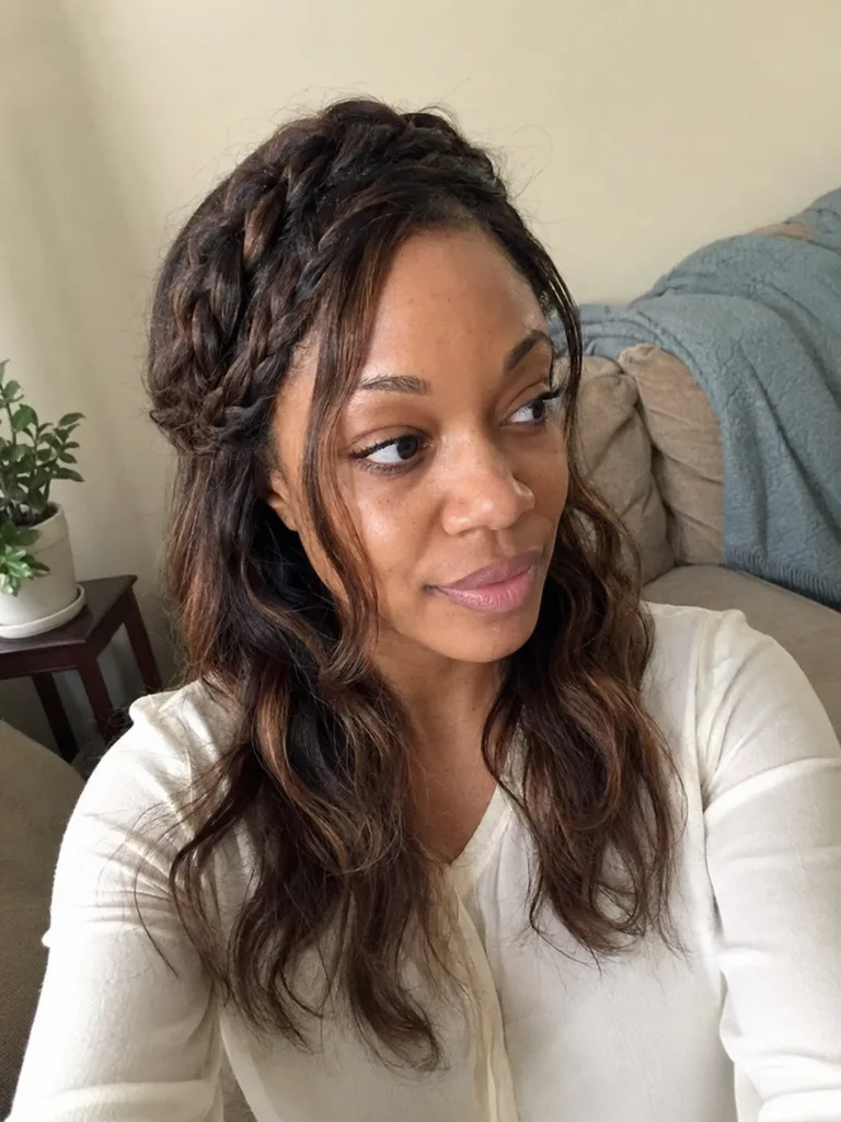Shoulder length brunette blowout in salon mirror.