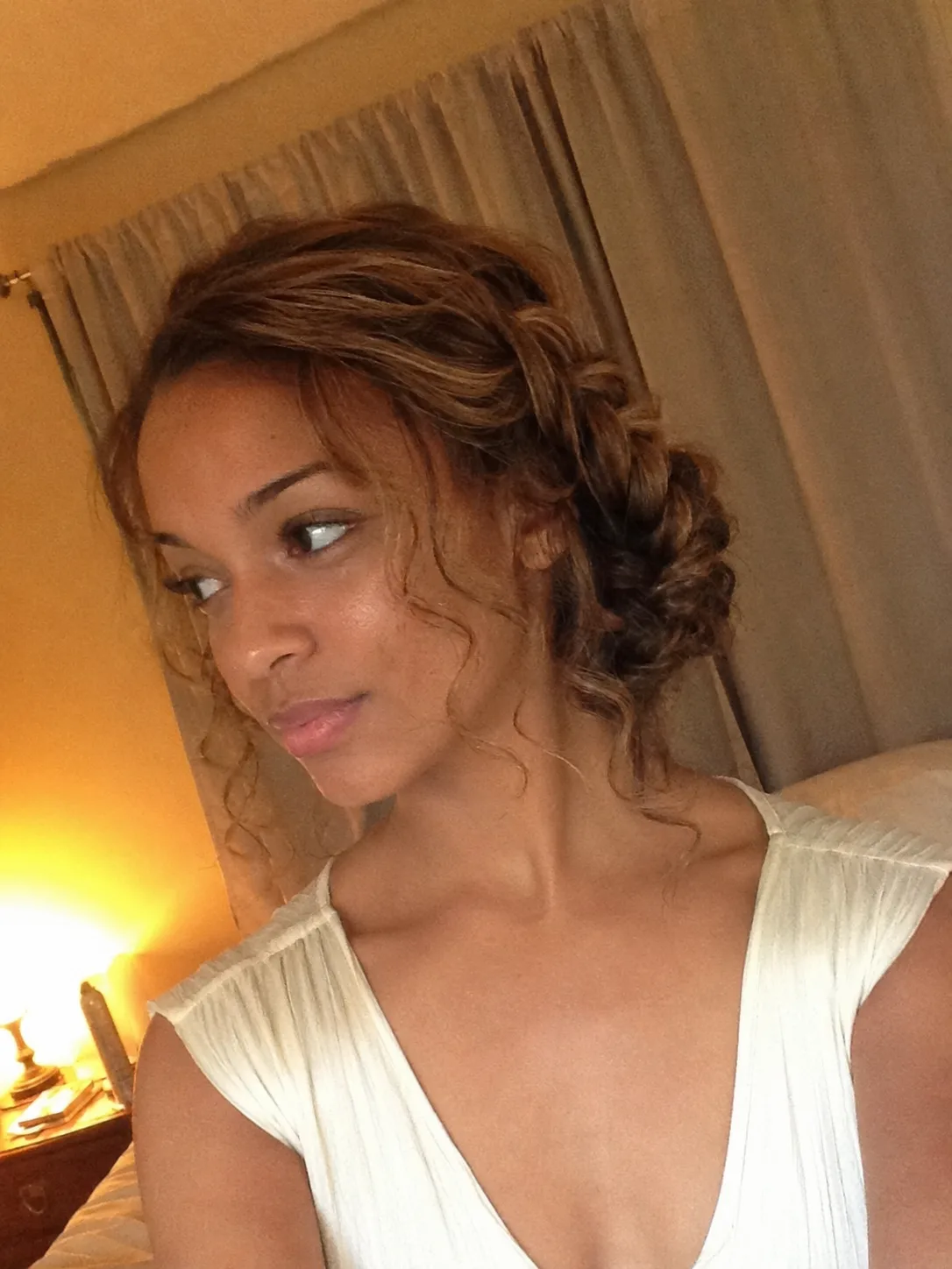 Side fishtail braid prom hairstyle with volume and soft face-framing layers
