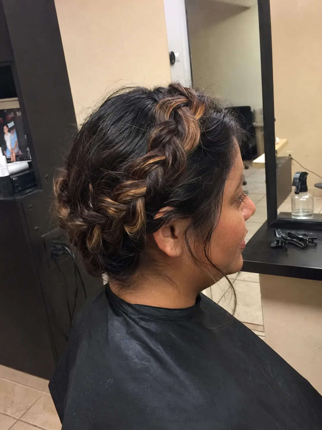Side profile showing an off-center part and thin elvish braid traveling back from the temple area