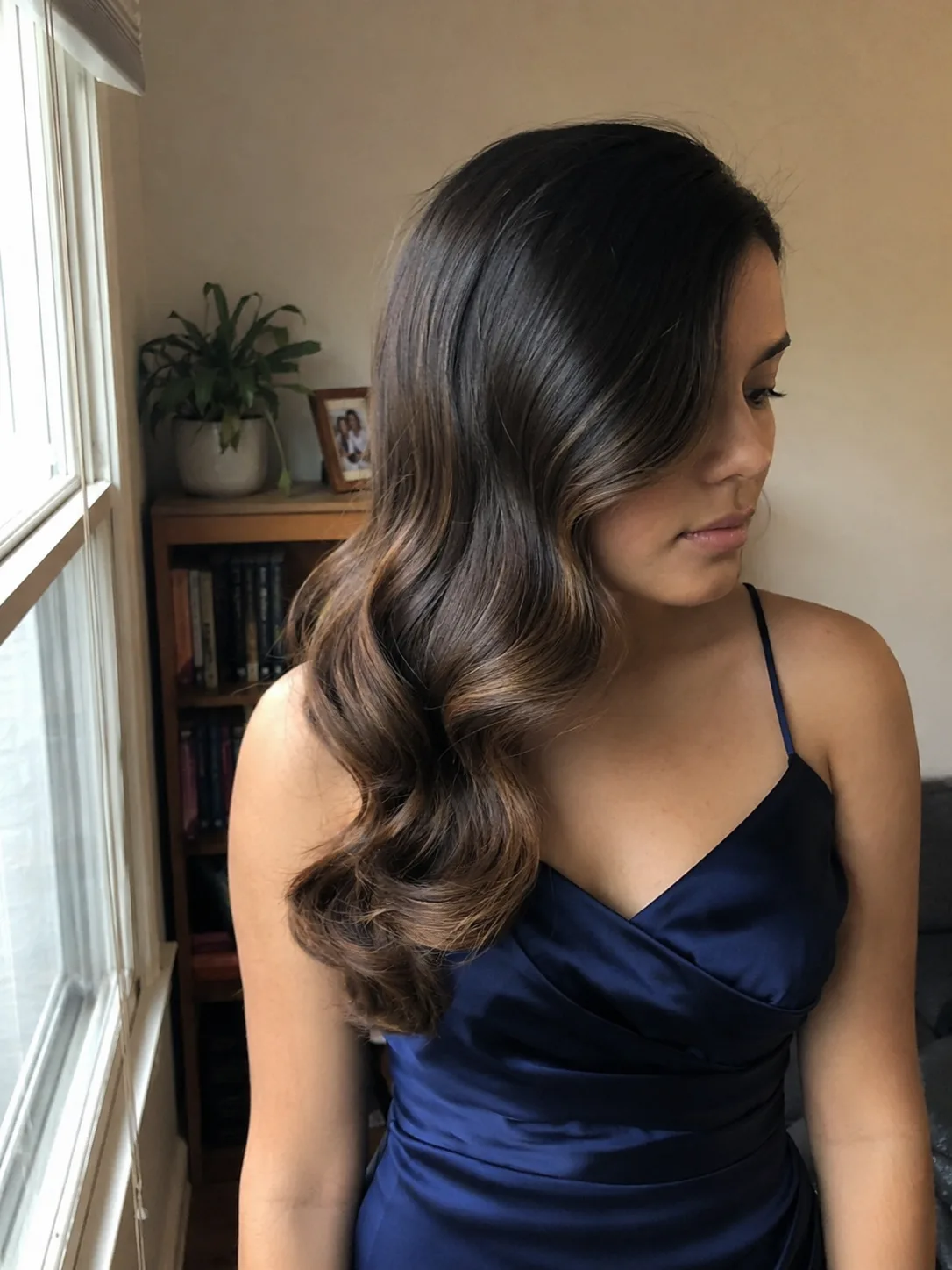 Sleek high ponytail prom hairstyle with smooth roots and long straight ponytail in bedroom mirror selfie