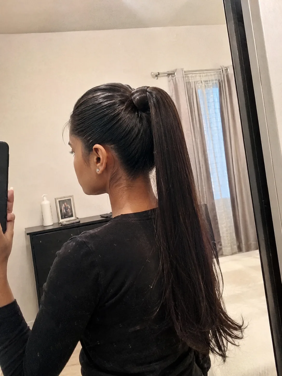 Sleek, high-shine formal low ponytail with perfectly polished surface wrapping