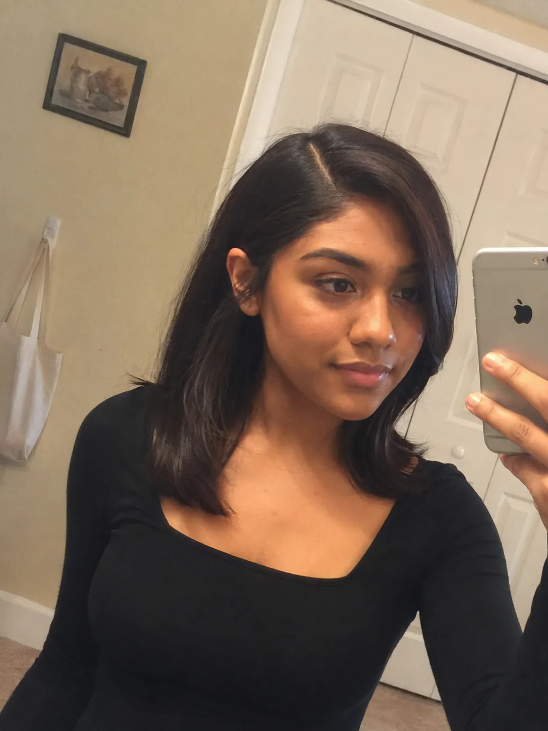 Sleek side part prom hairstyle for medium length hair with polished finish