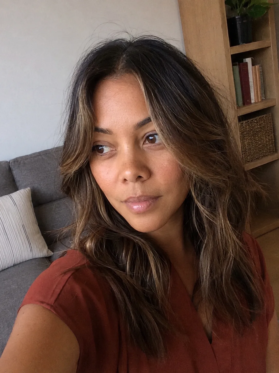 Soft blonde beach waves with face framing layers and natural texture.