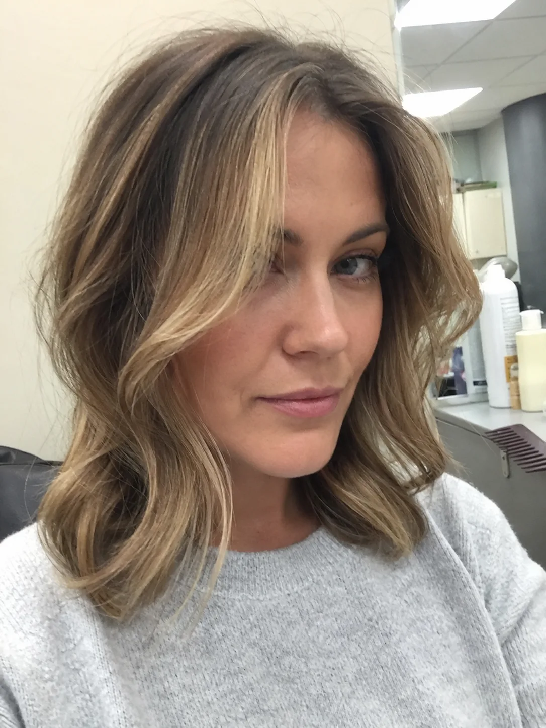Soft blonde bob with face framing layers and natural movement