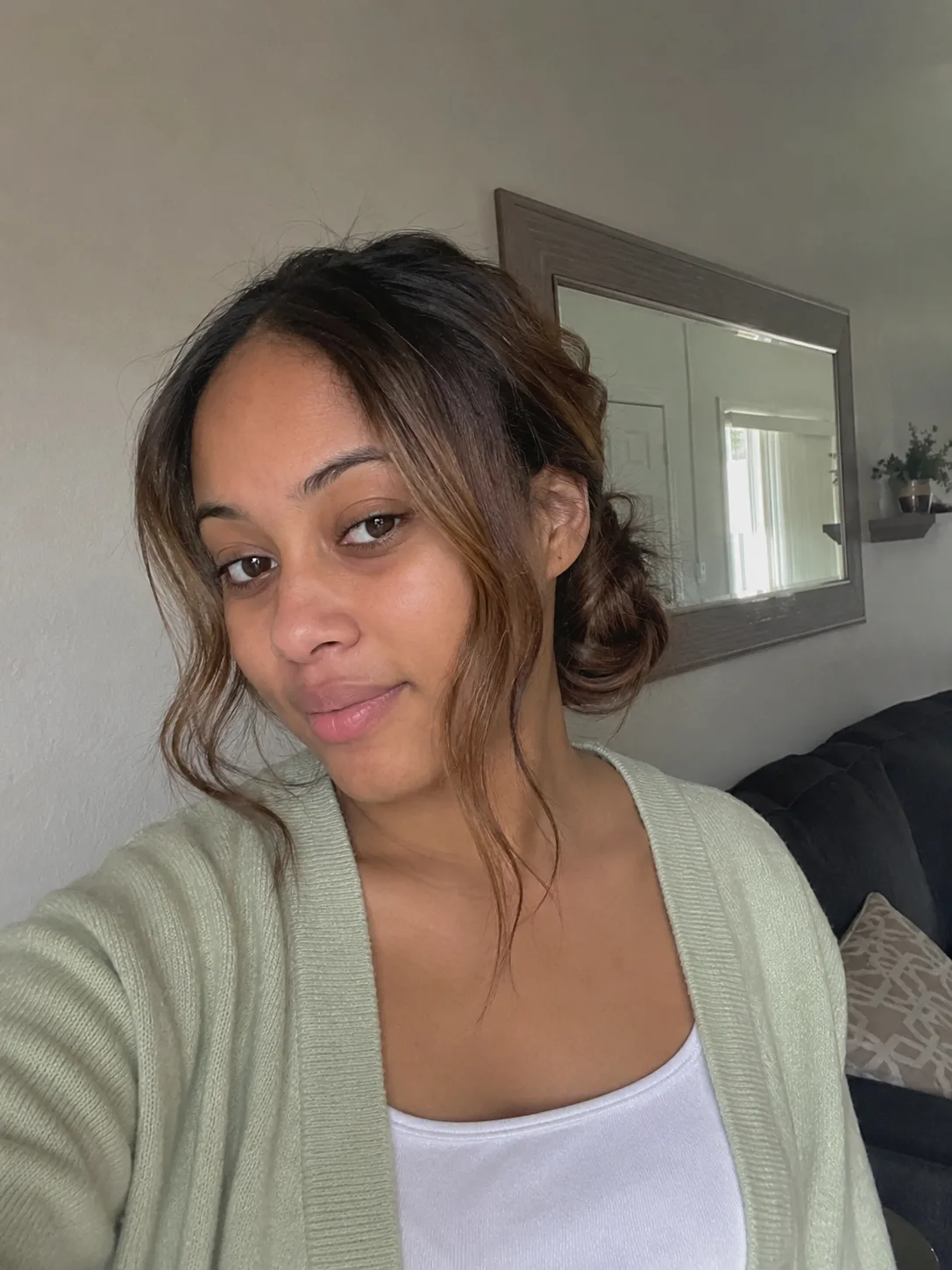 Soft low graduation bun with loose face-framing pieces