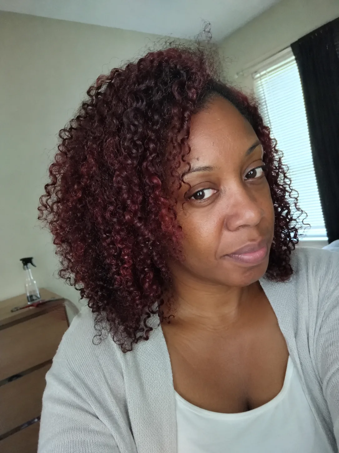 Soft, natural strawberry blonde and pale copper messy shaggy haircut on a woman with freckles
