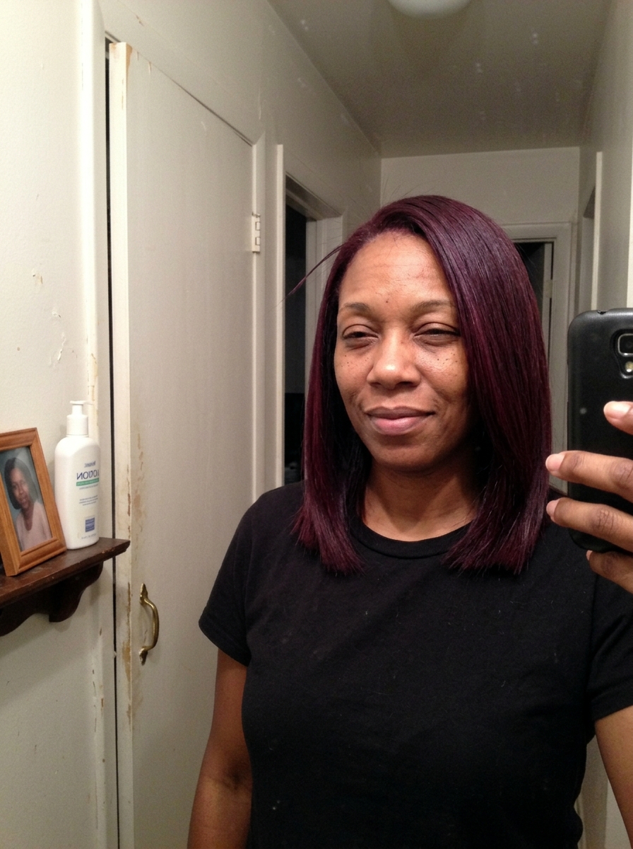 Soft pinkish-mauve hair with visible face-framing money piece highlights