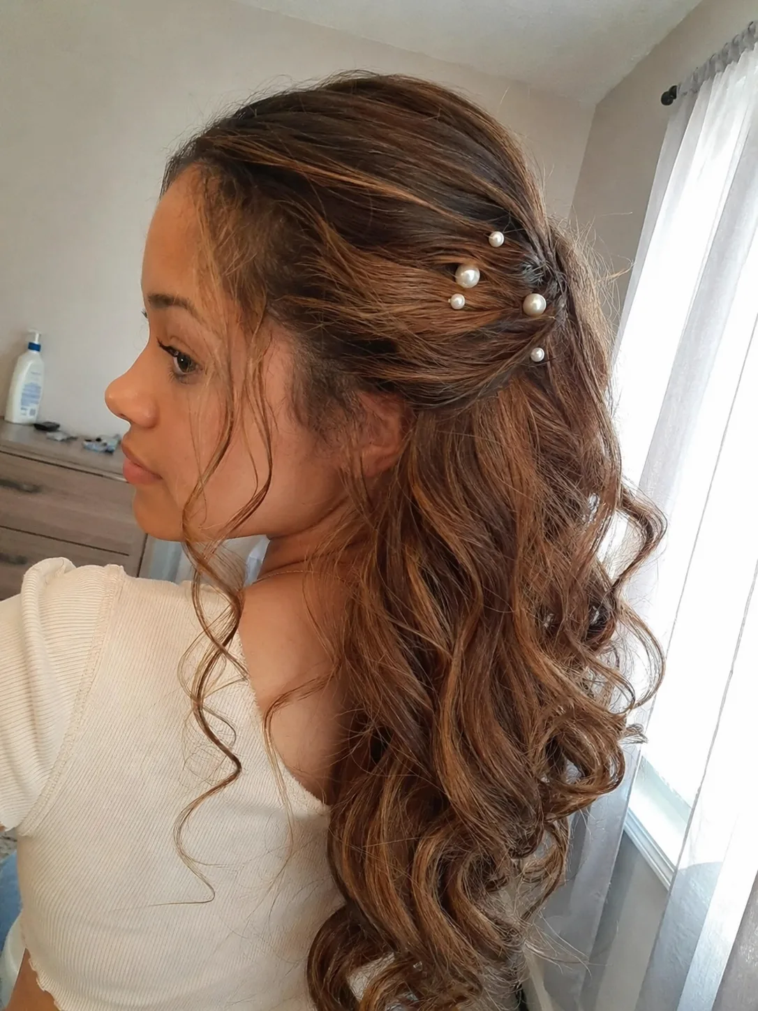 Soft side ponytail prom hairstyle with long curls