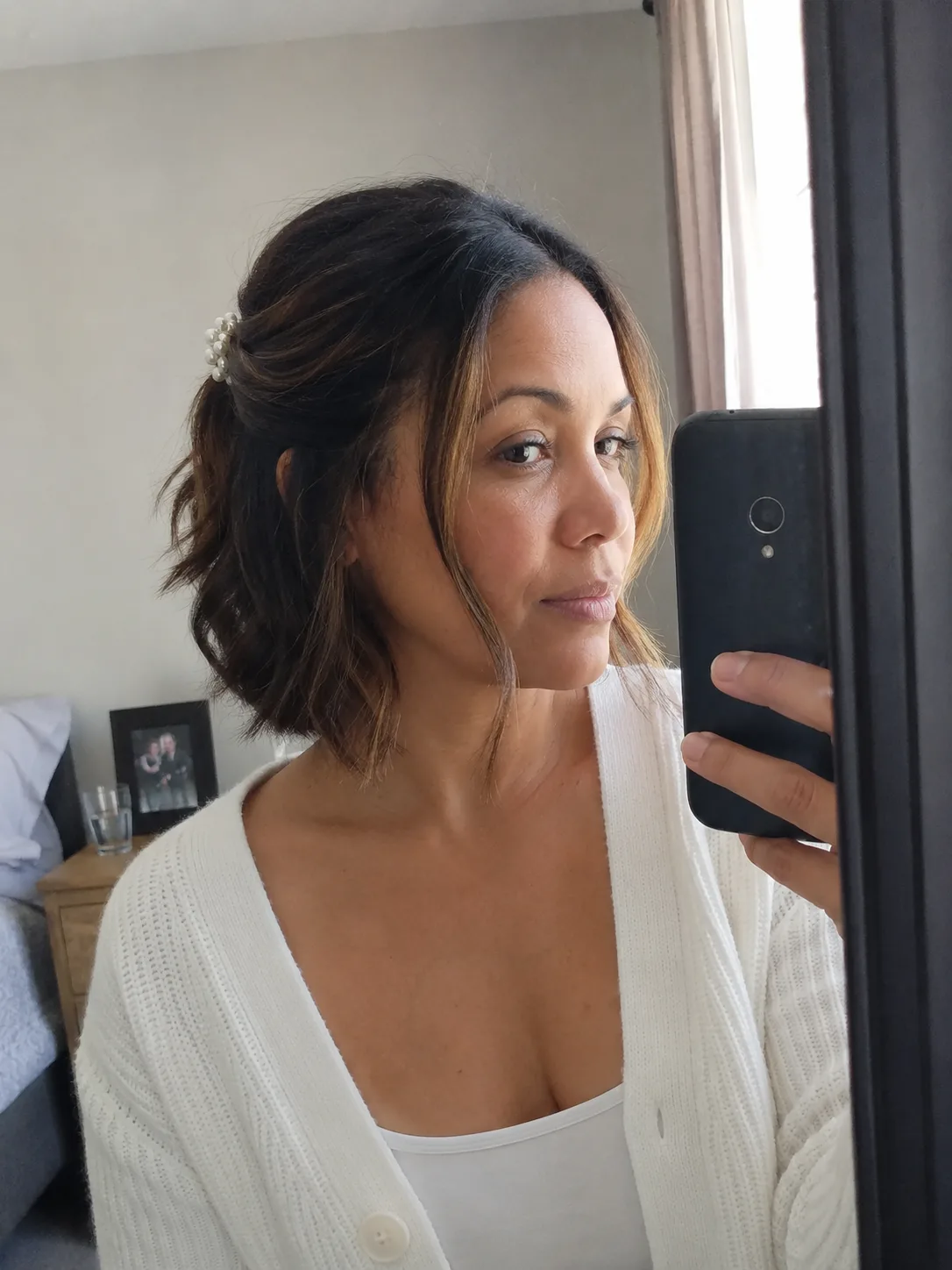 Softly layered bob haircut with natural volume, designed to move and settle naturally during a reception