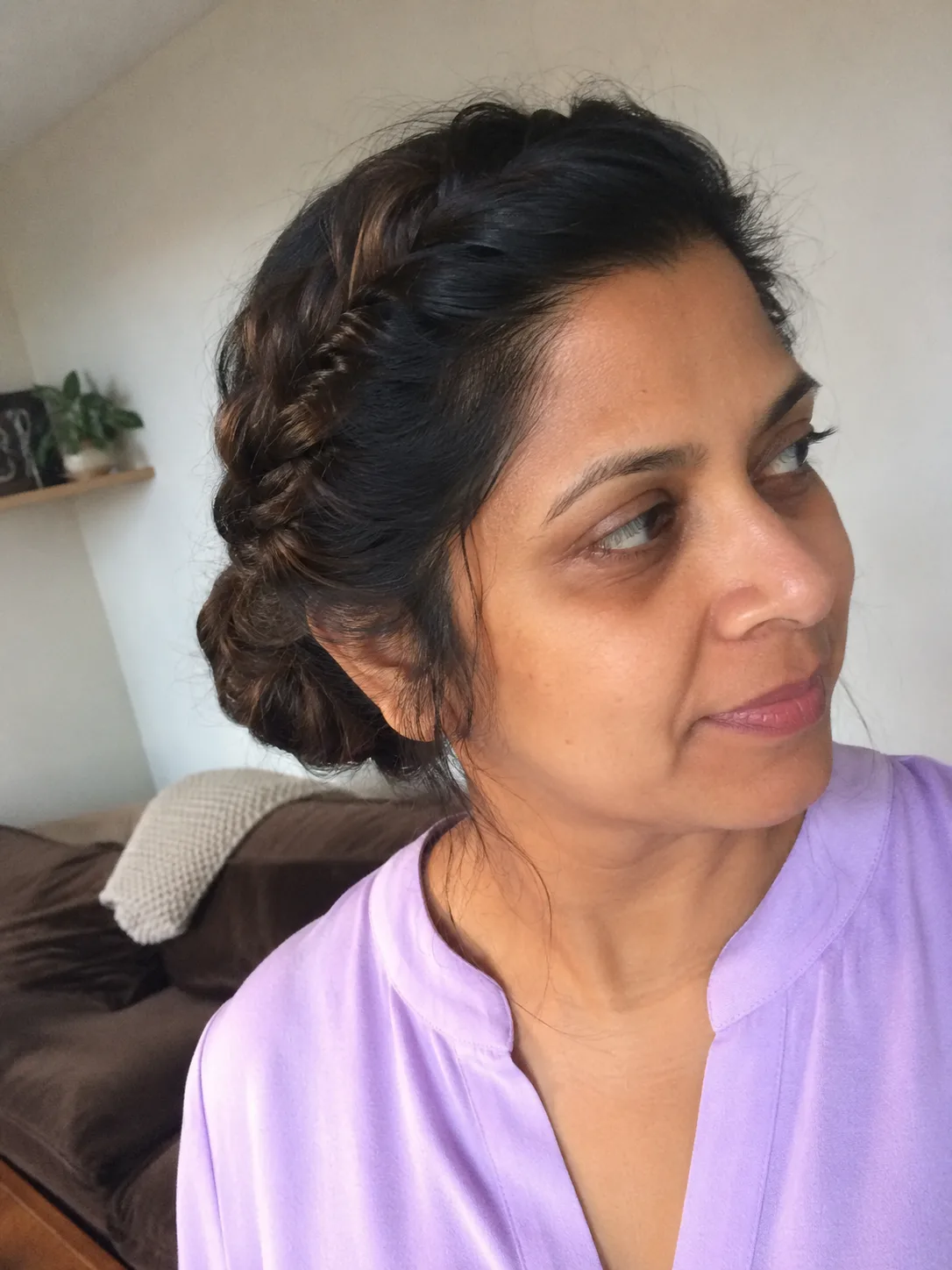 Structured bridesmaid French twist updo from side view