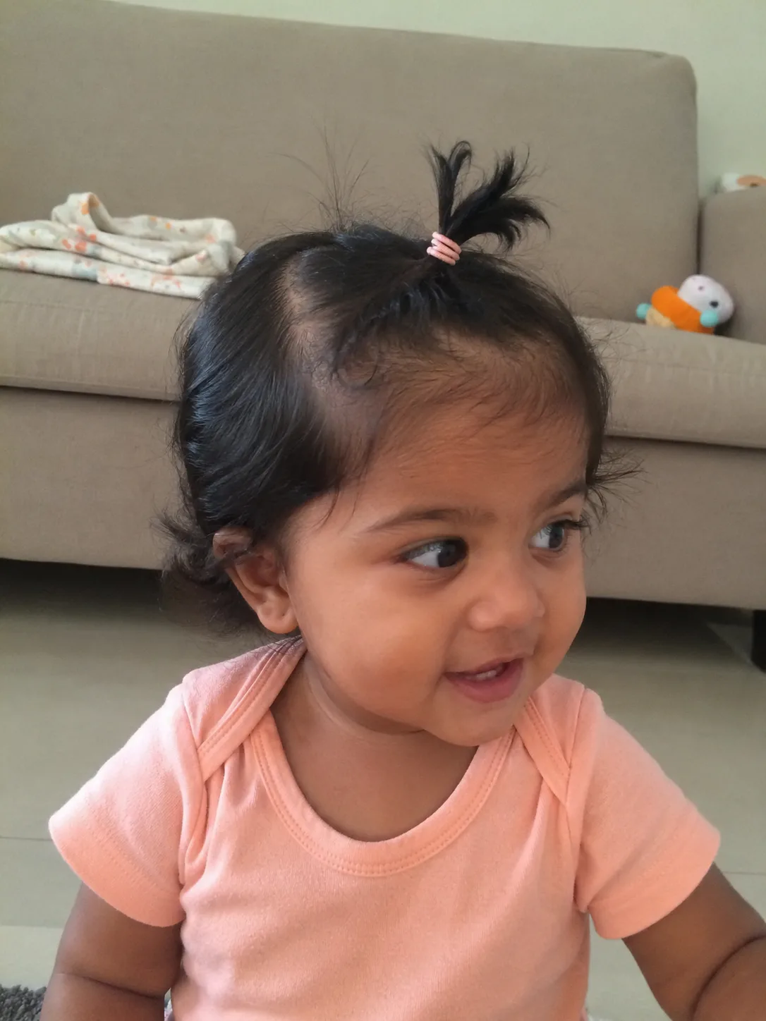 Unevenly growing baby hairline showcasing natural variations at the back and sides