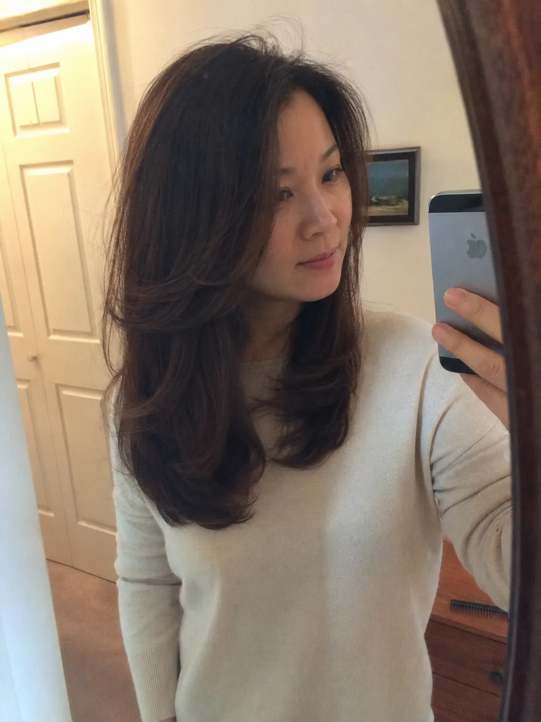 Voluminous, salon-styled formal blowout on long layered brown hair