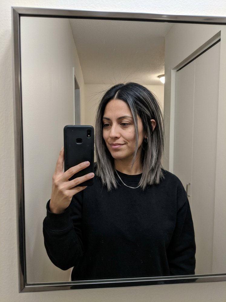 Shoulder-length light brown waves with soft highlights and layers