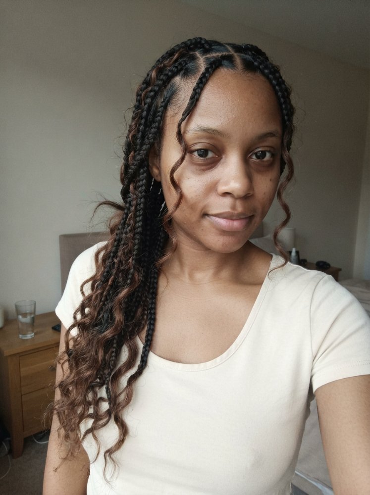 Goddess box braids hairstyle featuring precise braiding and a long lasting neat look.