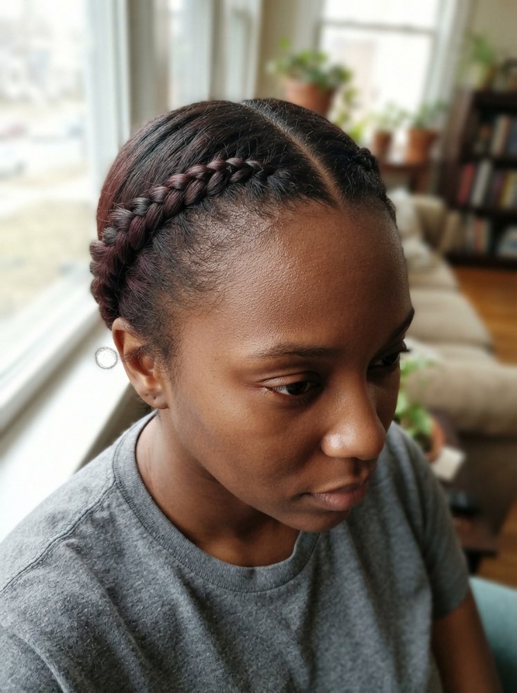 Cornrows on Black hairstyle styled with defined braids and a soft natural finish