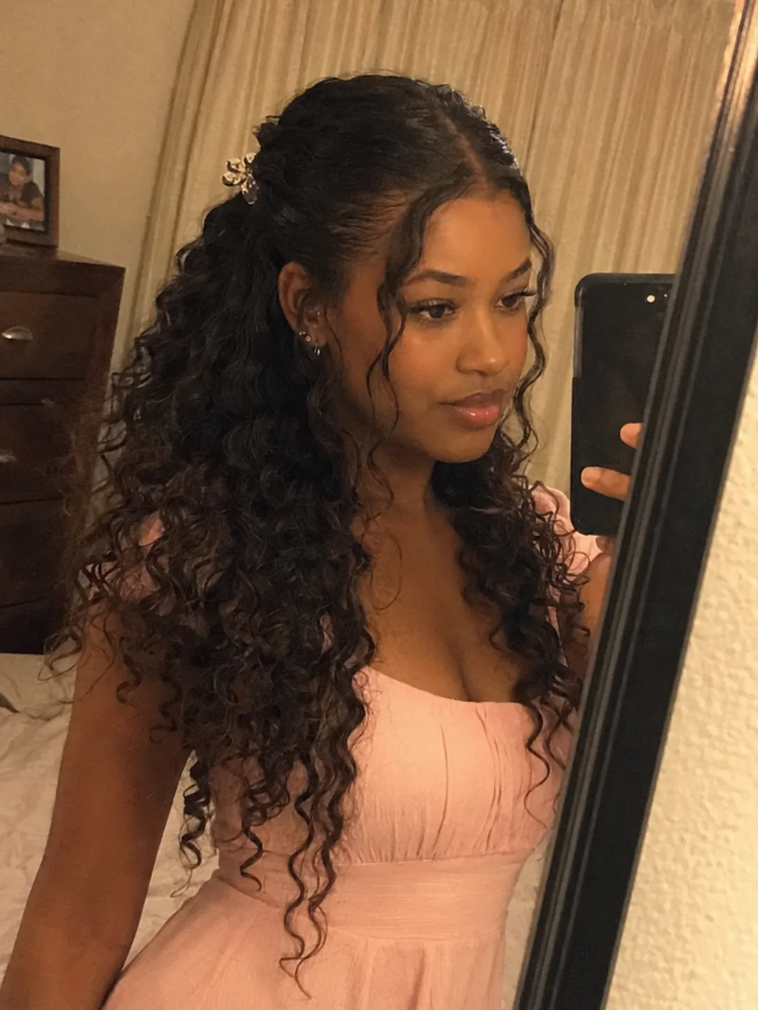 long curly half up hairstyle with defined curls