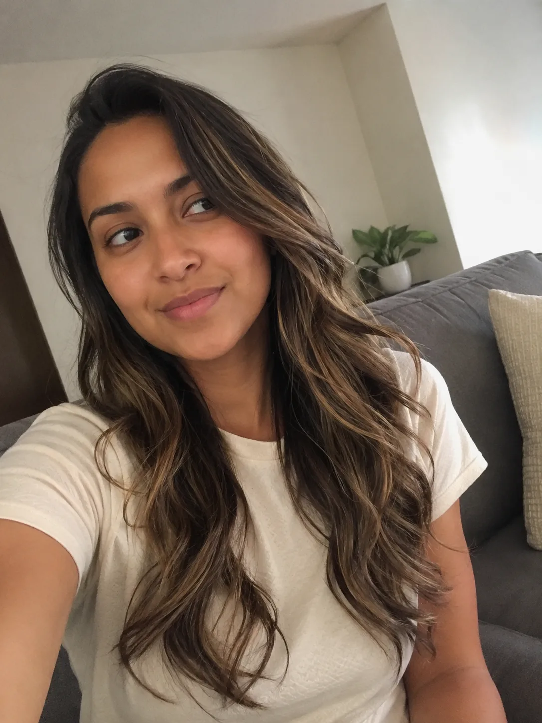 long highlighted hair with grown out layers and soft waves