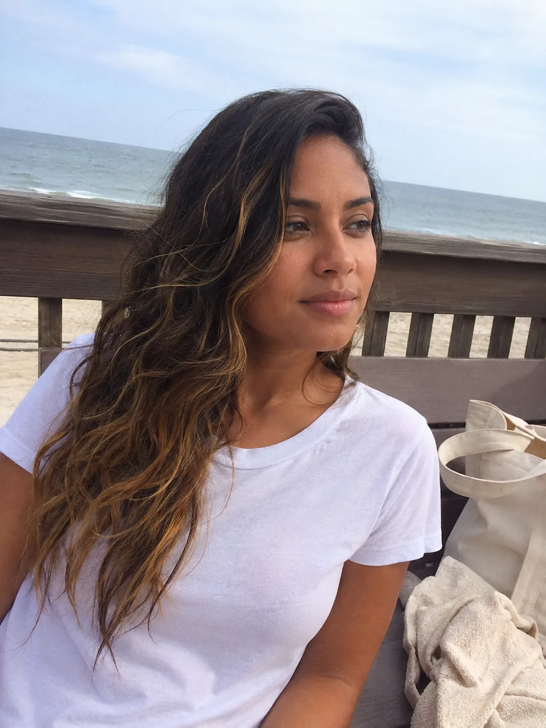 long wavy hair with natural beach texture and warm highlights