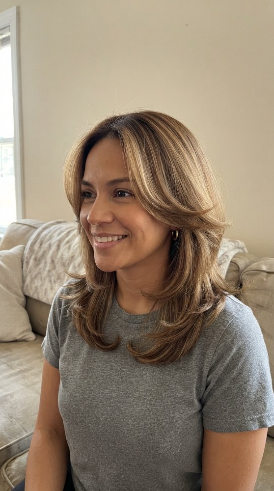 Medium to dark brown hair with blonde and light brown highlights