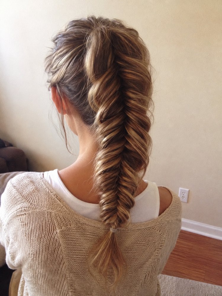 multi dimensional medium long length hairstyle The hair is a multi-dimensional, medium to long length hairstyle with a braided design