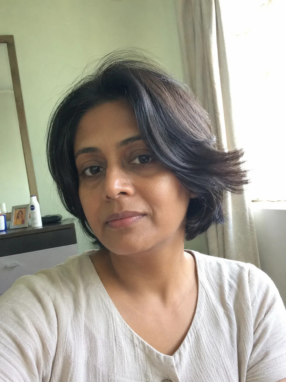 short curly pixie haircut for women with soft cropped texture