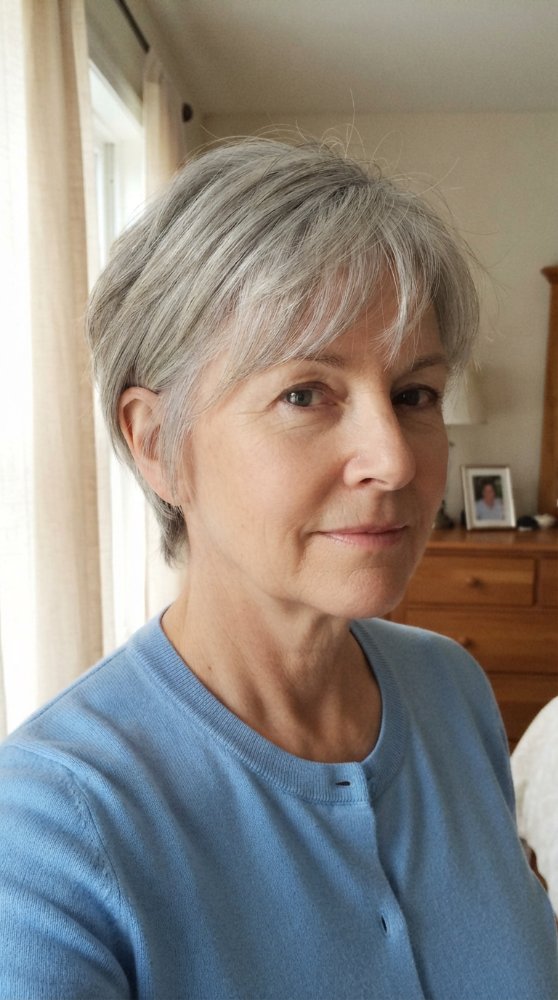 The hair is short in length, with a light gray color and a slightly wispy texture.