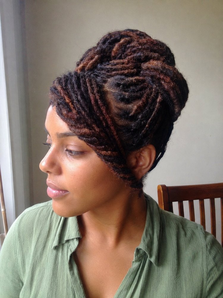 styled bun appears made dark The hair is styled in a bun and appears to be made up of dark brown and reddish-brown locs, with a multi