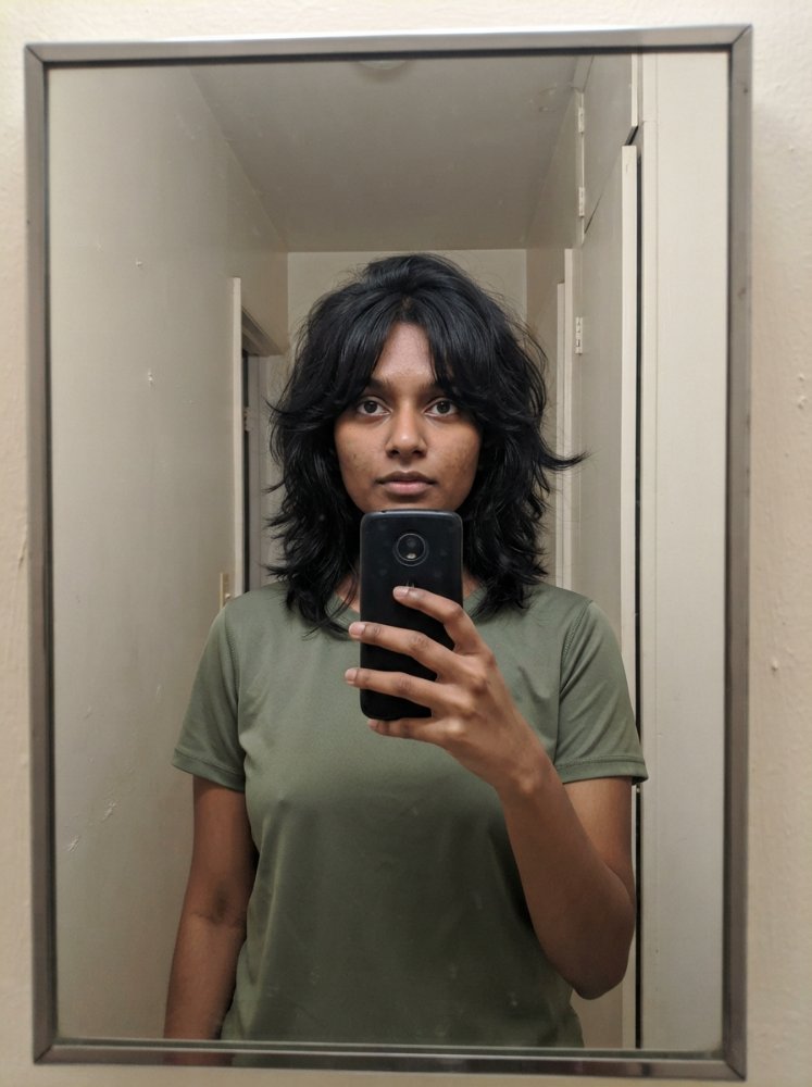 Shoulder-length light brown waves with soft highlights and layers